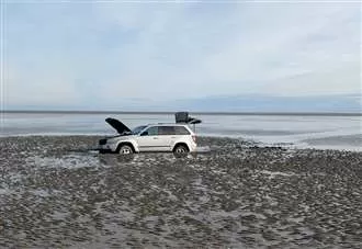 Police investigation after car abandoned on beach