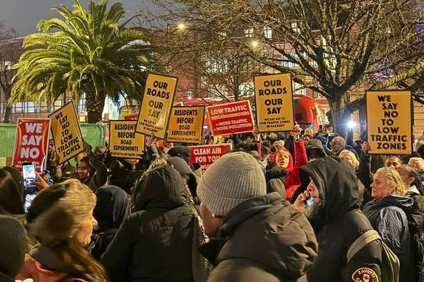 Dozens of protesters surround Hackney Town Hall chanting 'open our roads' and force halt to meeting