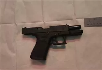 Man charged after 55 loaded pistols and 500 rounds of ammo seized