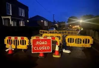 Road cordoned off due to sinkhole